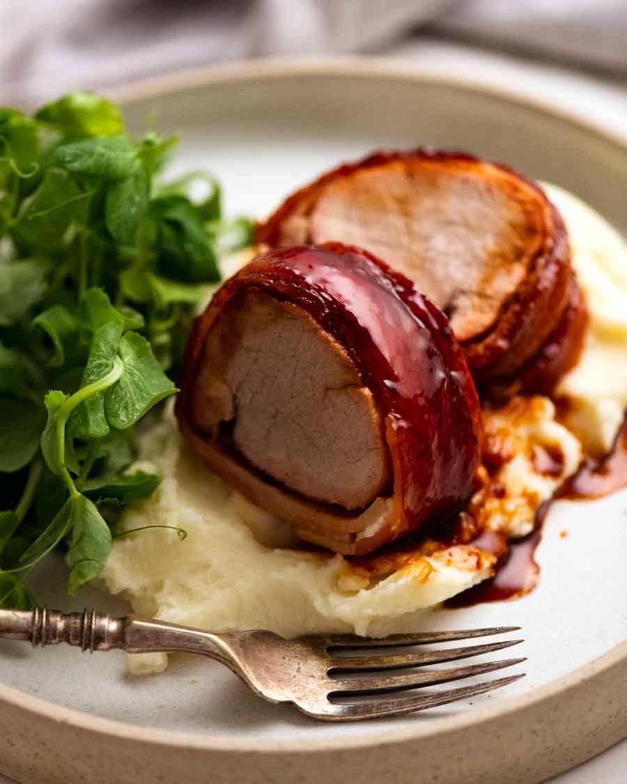 Close up of slices of Bacon wrapped pork tenderloin