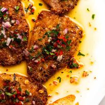 Close up overhead photo of Mediterranean Crusted Sardines on a plate, ready to be served