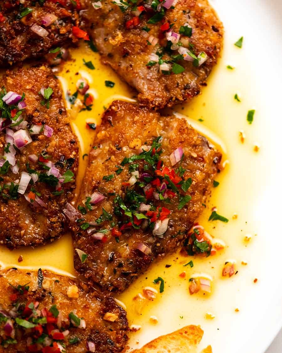 Close up overhead photo of Mediterranean Crusted Sardines on a plate, ready to be served