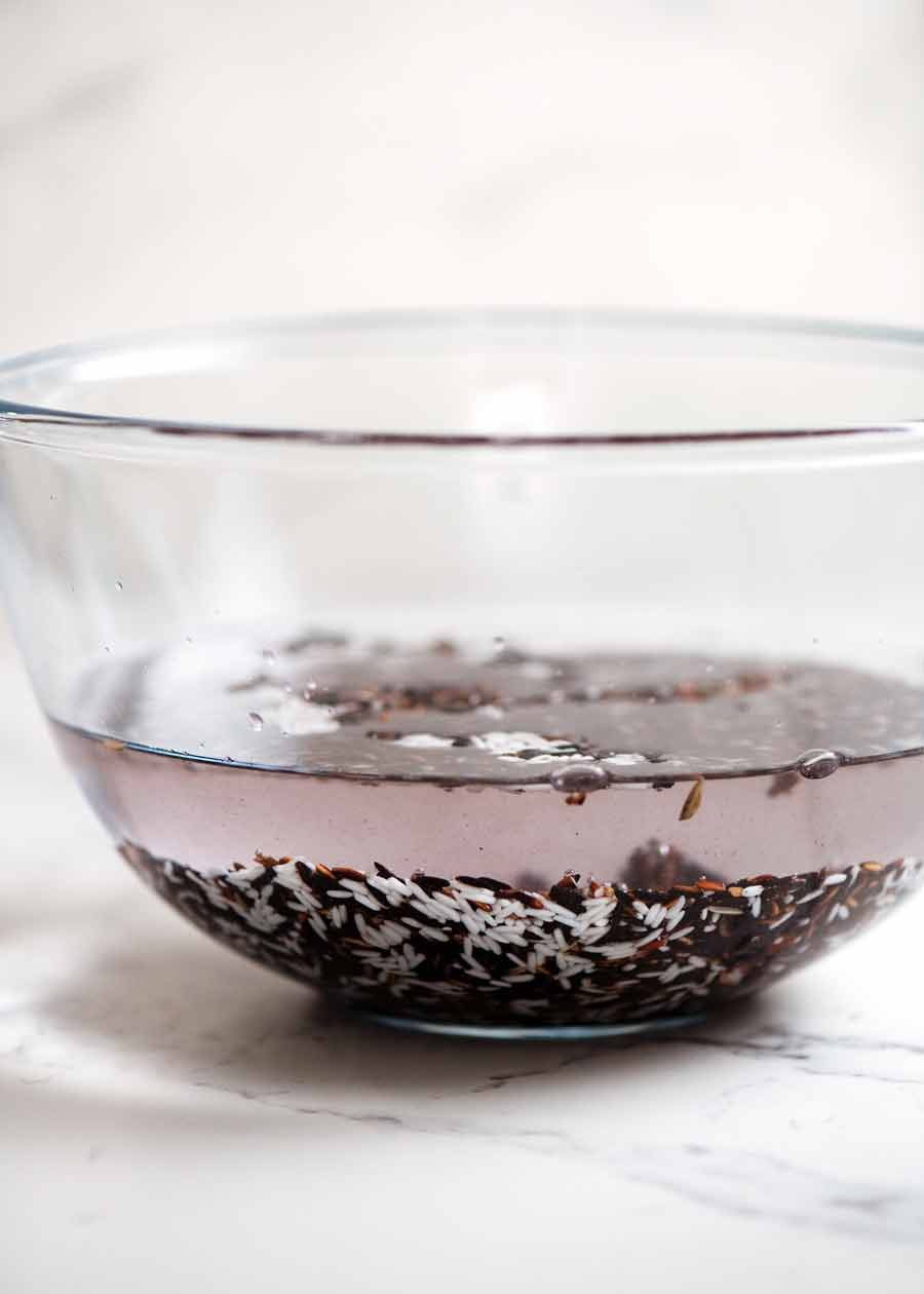 Soaking sticky rice for Thai Black Sticky Rice Pudding