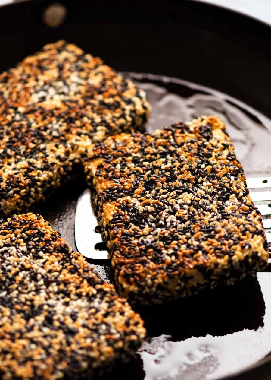 Sesame Crusted Tofu Steaks in a skillet