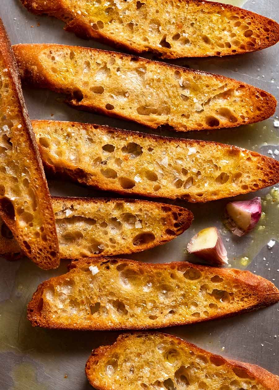 Freshly baked crostini on a tray