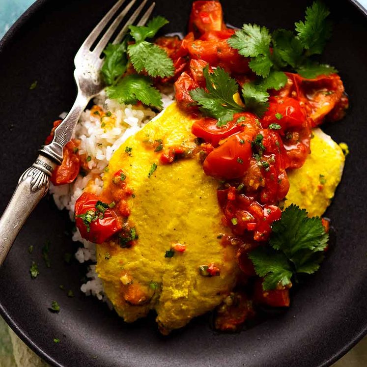 Overhead photo of Golden Turmeric Fish (Indonesian) made with John Dory served on rice, ready to be eaten