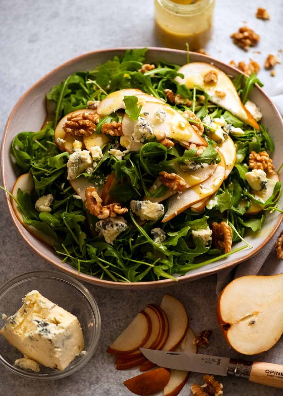 Pear Salad with Blue Cheese and Rocket Arugula in a serving bowl, ready to be eaten