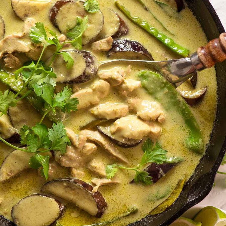 Thai Green Curry in a black skillet, fresh off the stove