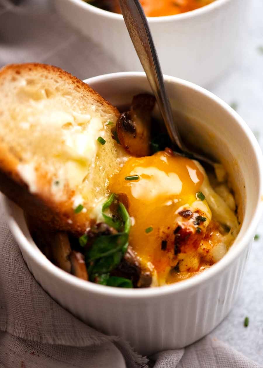 Dunking bread into Baked Eggs - Shirred Eggs