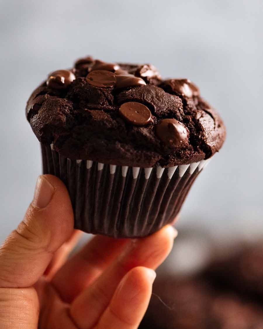 Hand holding Chocolate Muffin