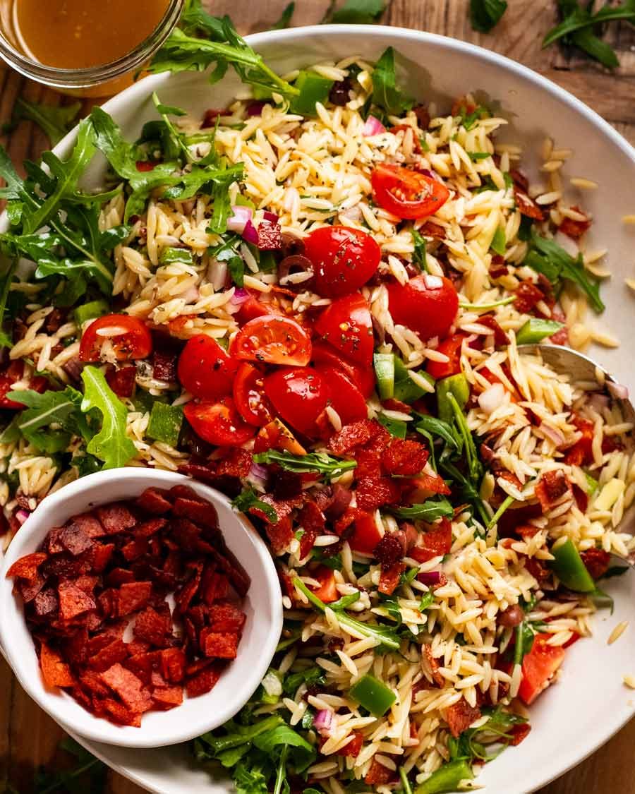 Big bowl of Italian risoni/ orzo salad with crispy salami bits