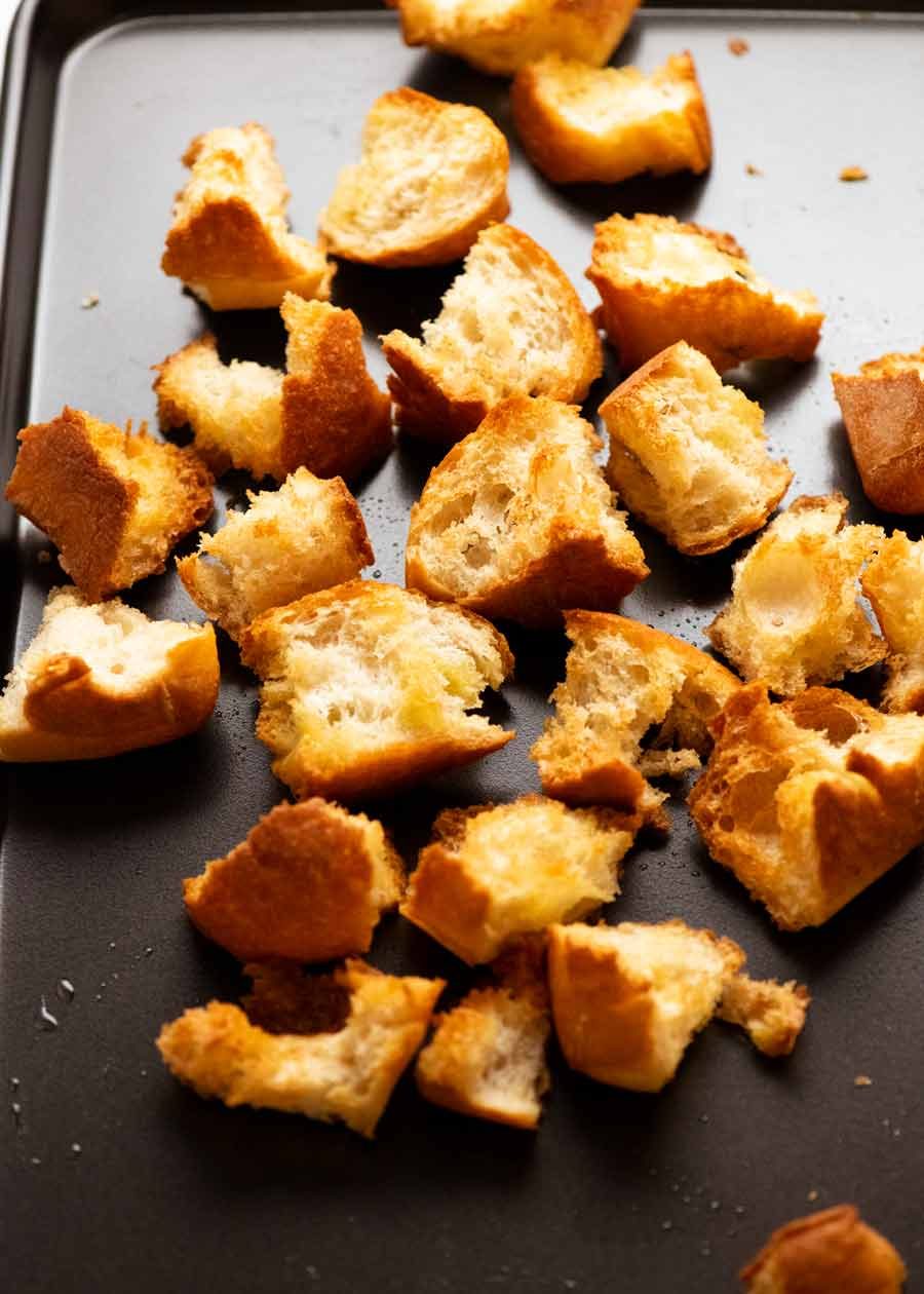 Toasting bread for Panzanella - Italian tomato and bread salad