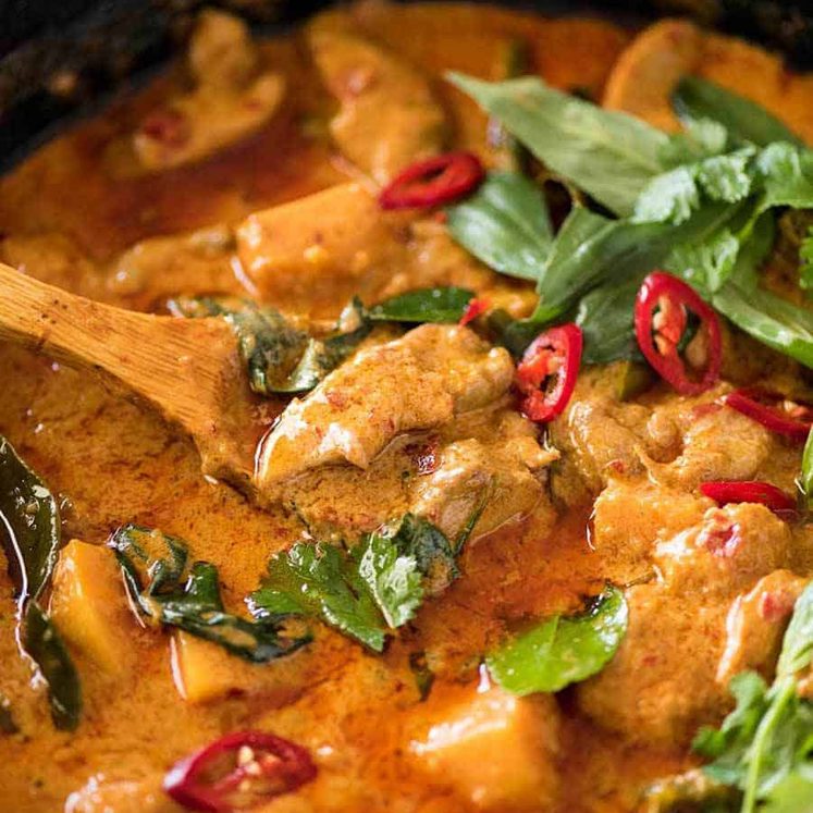 Thai Red Curry with Chicken in a skillet, fresh off the stove.