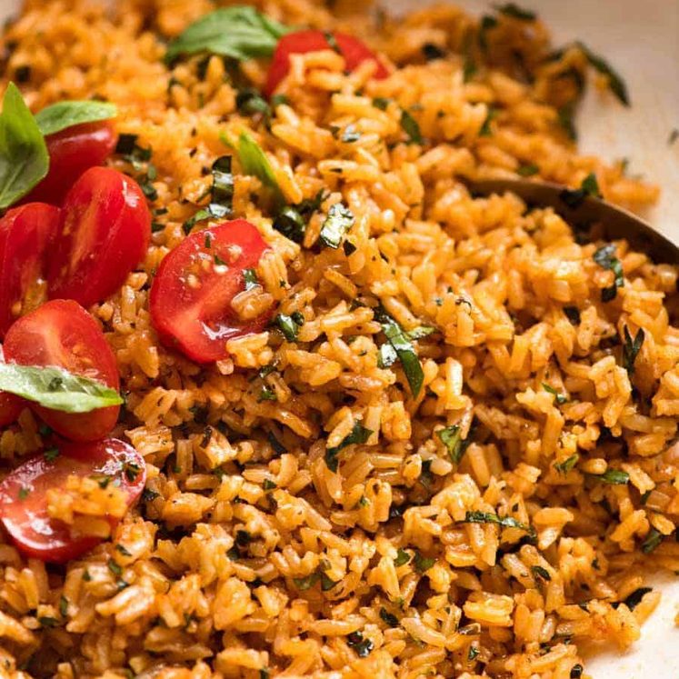 Close up of Tomato Basil Rice in a white bowl, ready to be served