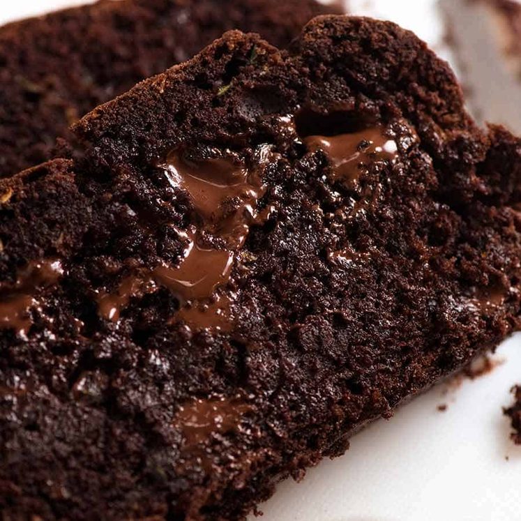 Close up of slice of the most amazing Chocolate Zucchini Bread with molten chocolate and fudgy insides!