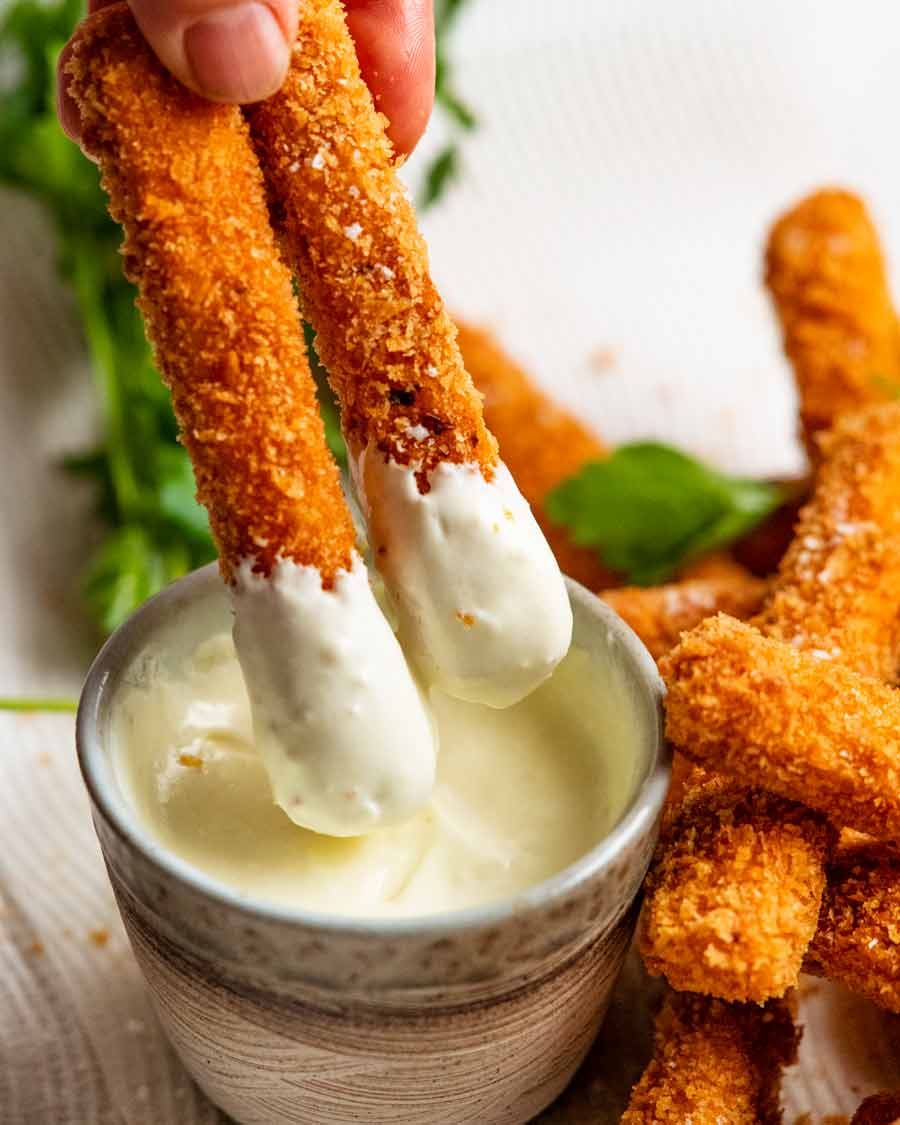 Dipping Haloumi fries in garlic sauce