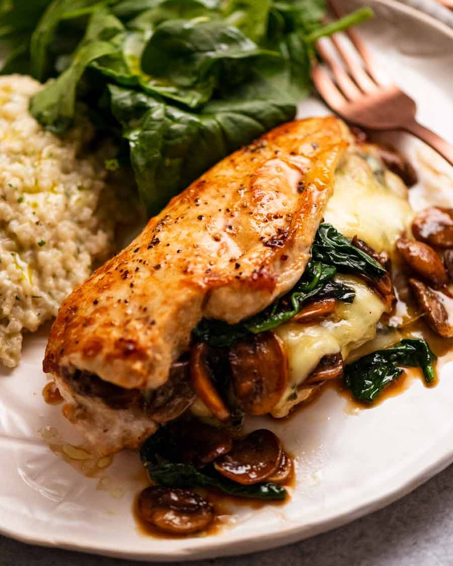 Mushroom Stuffed Chicken Breast on a plate ready to be eaten