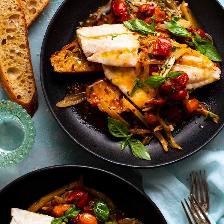 Overhead photo of 2 plates of Acqua Pazza - Italian Poached Fish