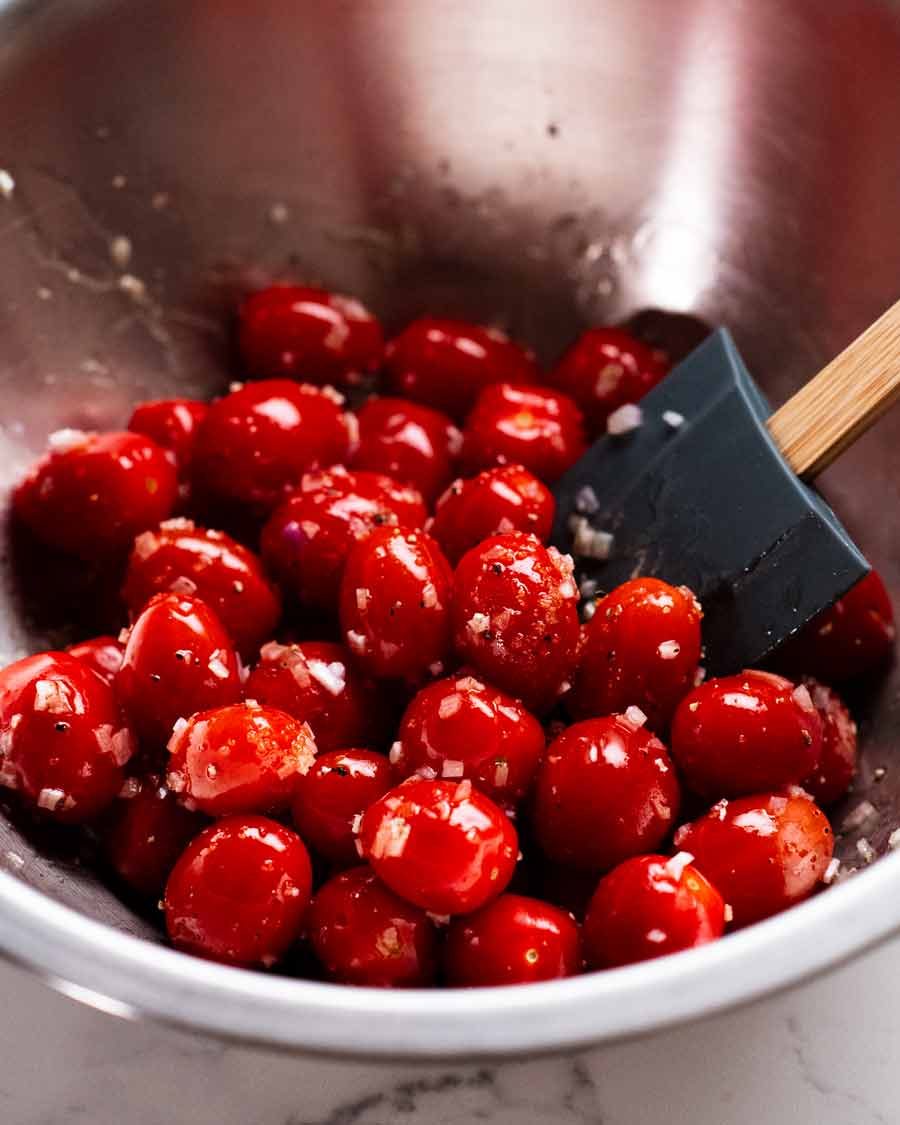 Tossing cherry tomatoes for roasting