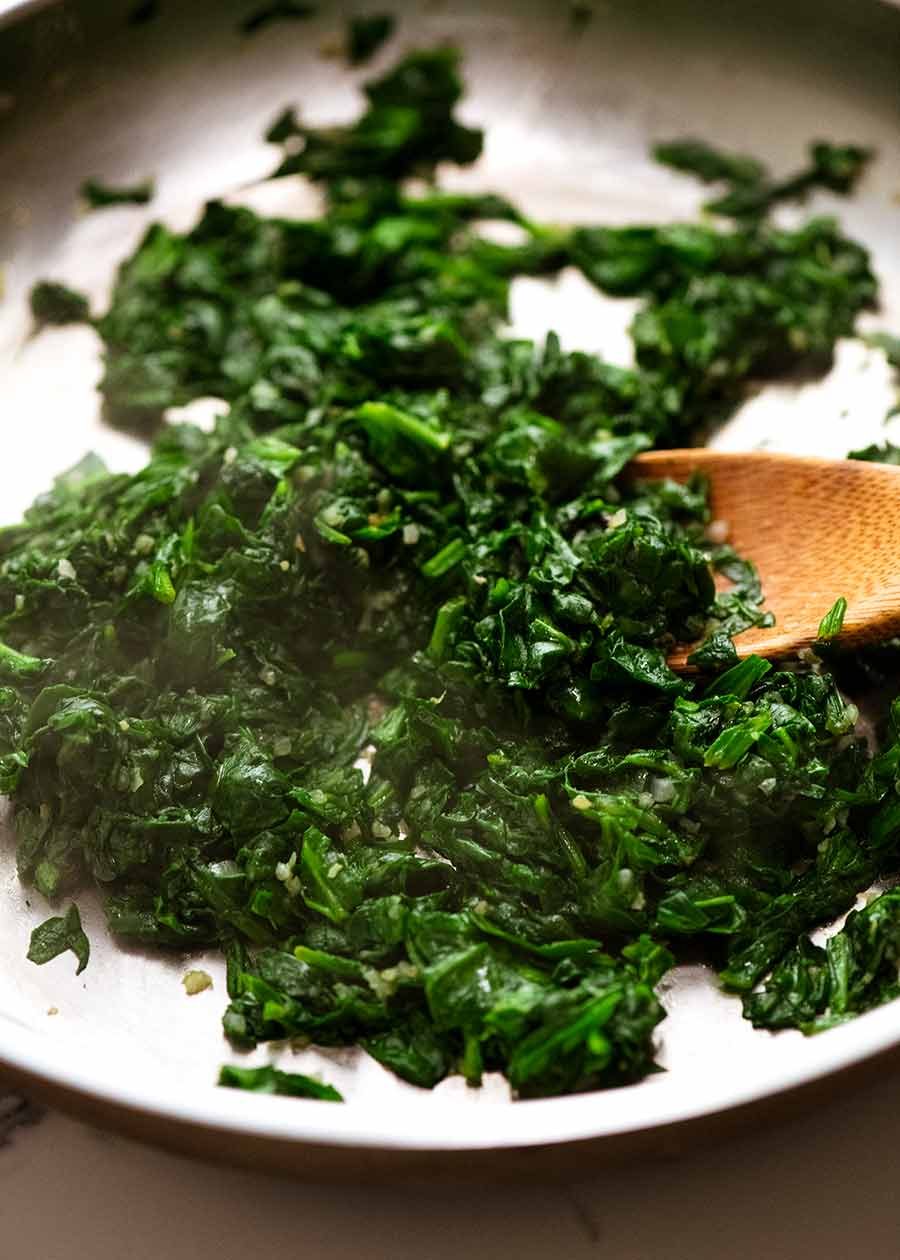 Pan of cooked spinach for Malfatti