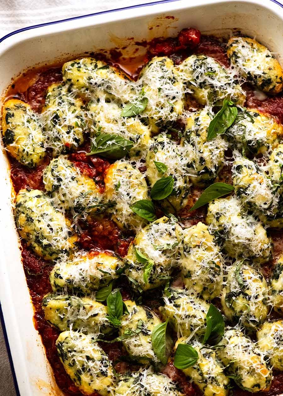 Pan of freshly cooked Malfatti - Italian Spinach Ricotta Dumplings ready to be served