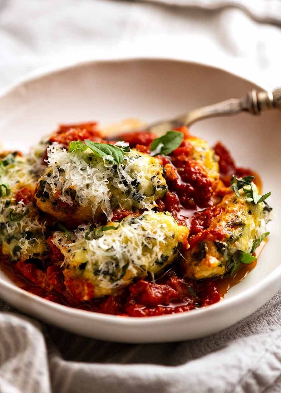 Bowl of Malfatti - Italian Spinach Ricotta Dumplings, ready to be eaten