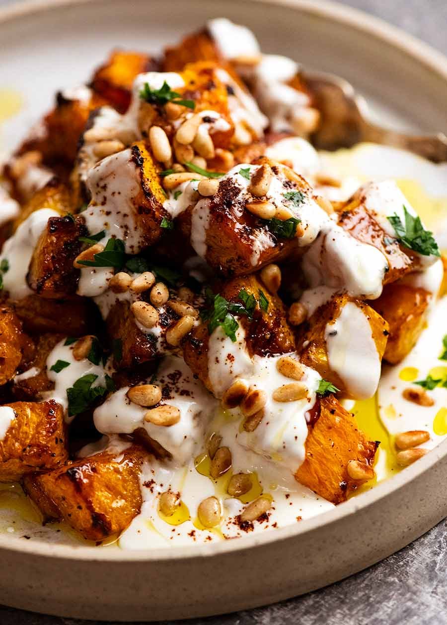 Roast Pumpkin with Yogurt Sauce and Pine Nuts on a plate, freshly made