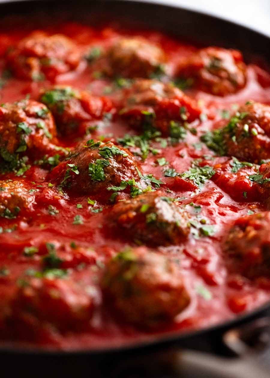 Skillet with simmering Mexican Meatballs