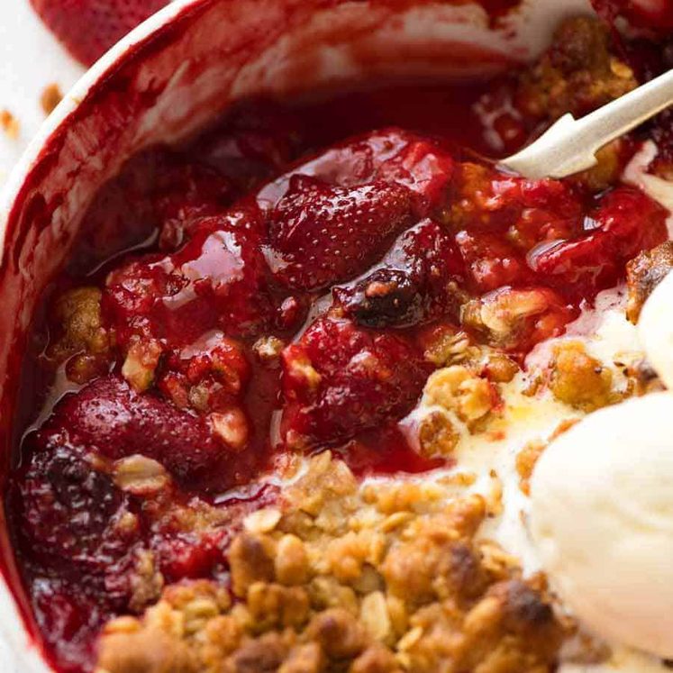 Close up showing the syrupy strawberry filling of Strawberry Crumble