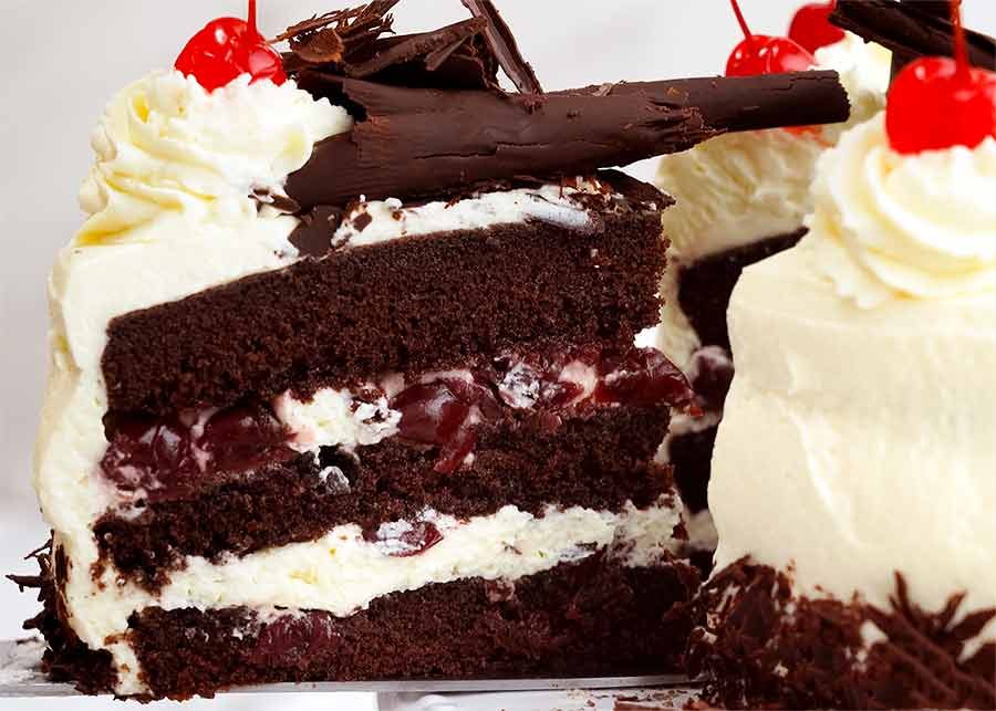 Pulling out a slice of Black Forest Cake