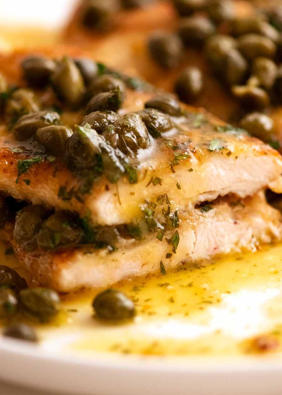 Close up of cut pieces of Chicken Piccata