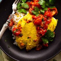 Overhead photo of Golden Turmeric Fish (Indonesian) made with John Dory served on rice, ready to be eaten