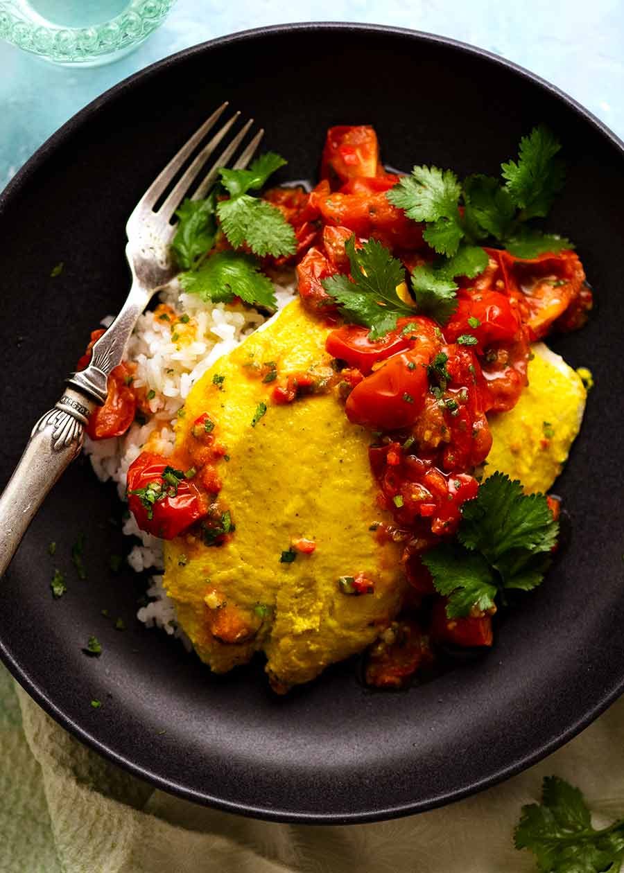 Overhead photo of Golden Turmeric Fish (Indonesian) made with John Dory served on rice, ready to be eaten