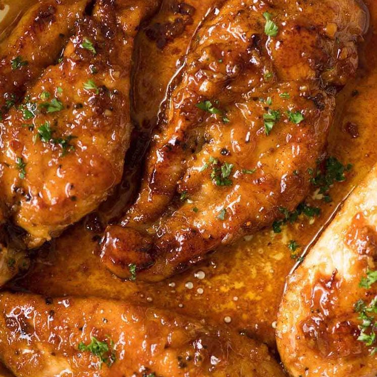 Close up photo of Honey Garlic Chicken in a skillet, fresh off the stove