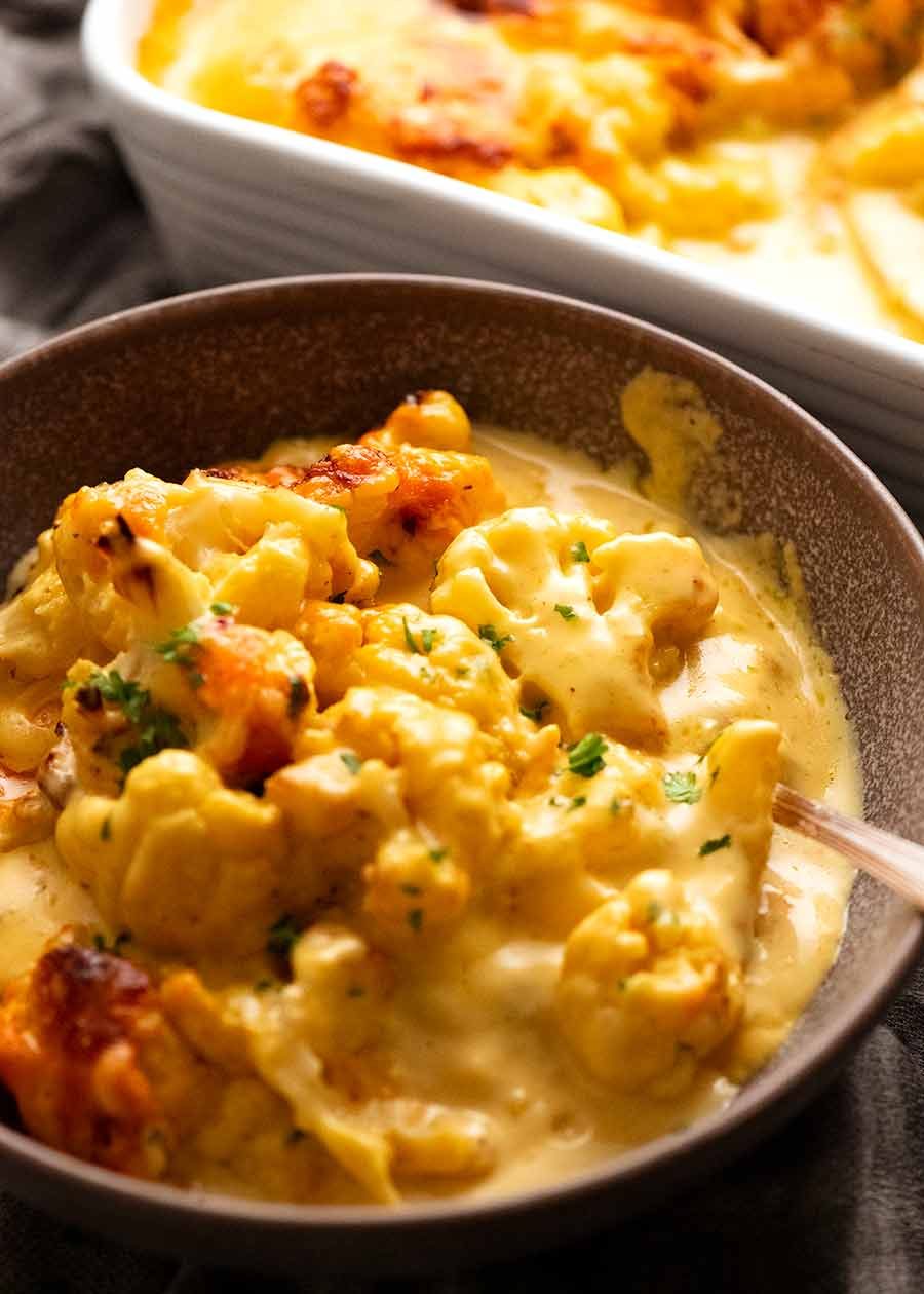 Cauliflower Cheese in a bowl, ready to be eaten