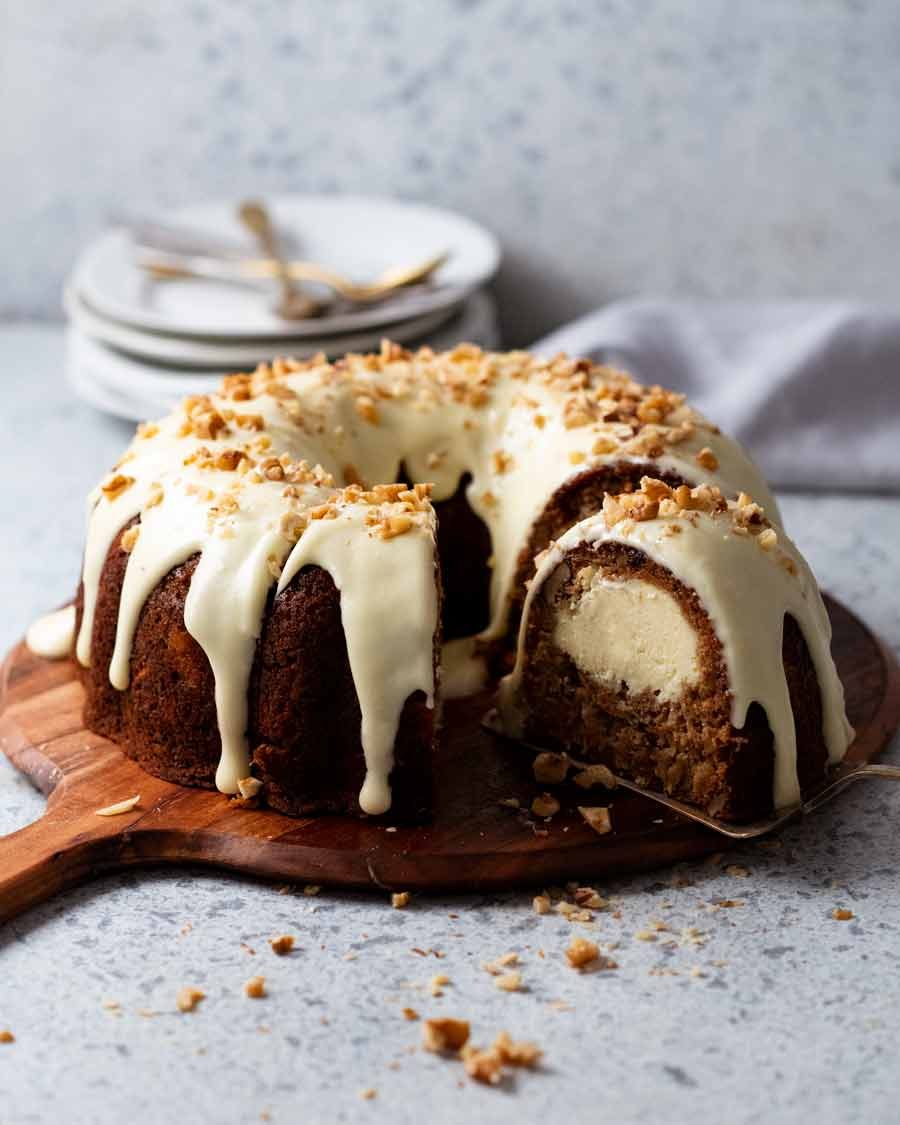 Cheesecake stuffed carrot bundt cake on a platter ready to be served