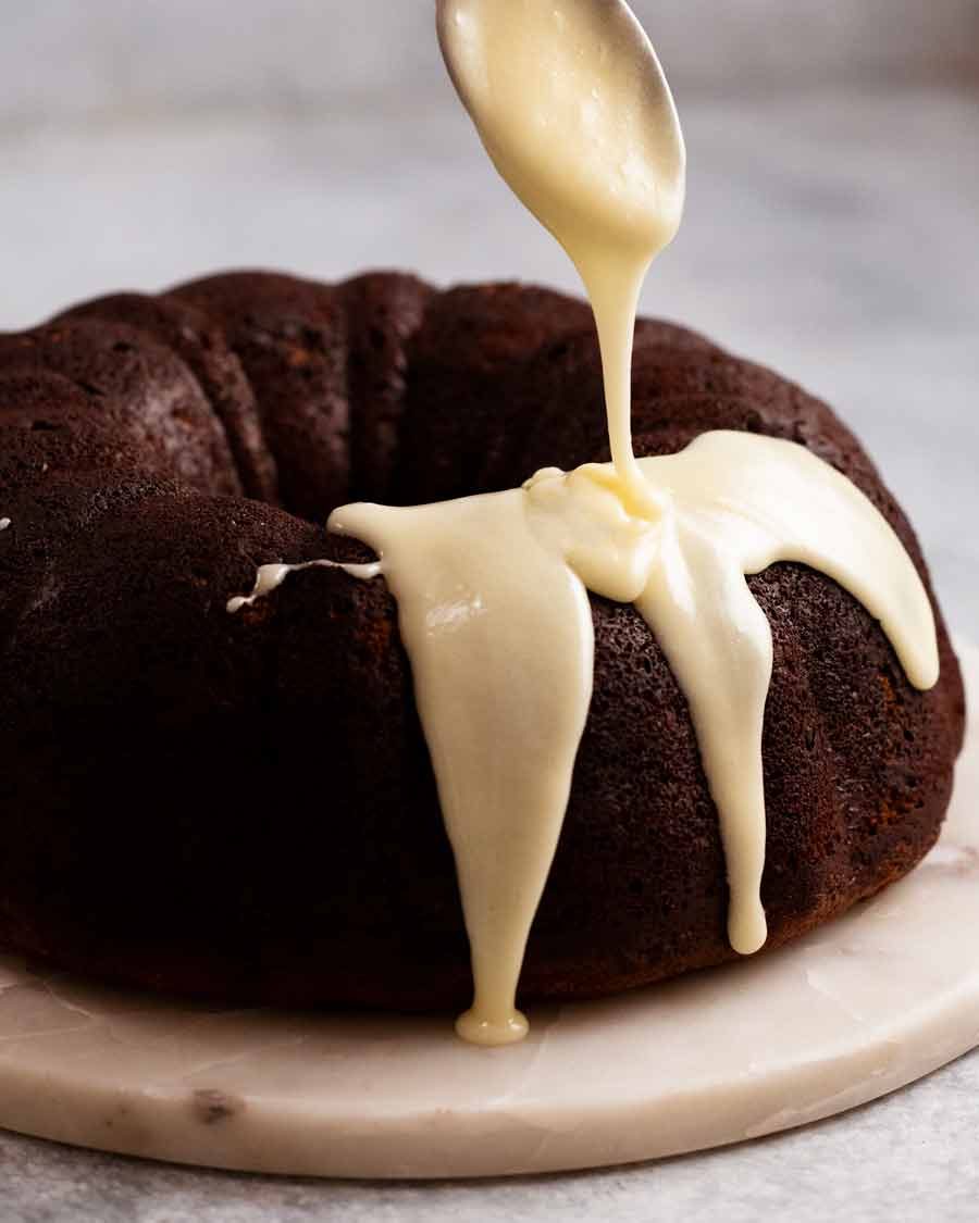 Glazing Cheesecake stuffed carrot bundt cake