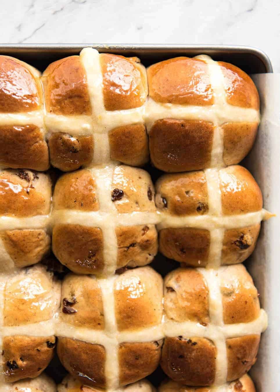 Easy Hot Cross Buns Recipe - perfectly spiced, fluffy and moist, with a no knead, no stand mixer option! www.reciptineats.com