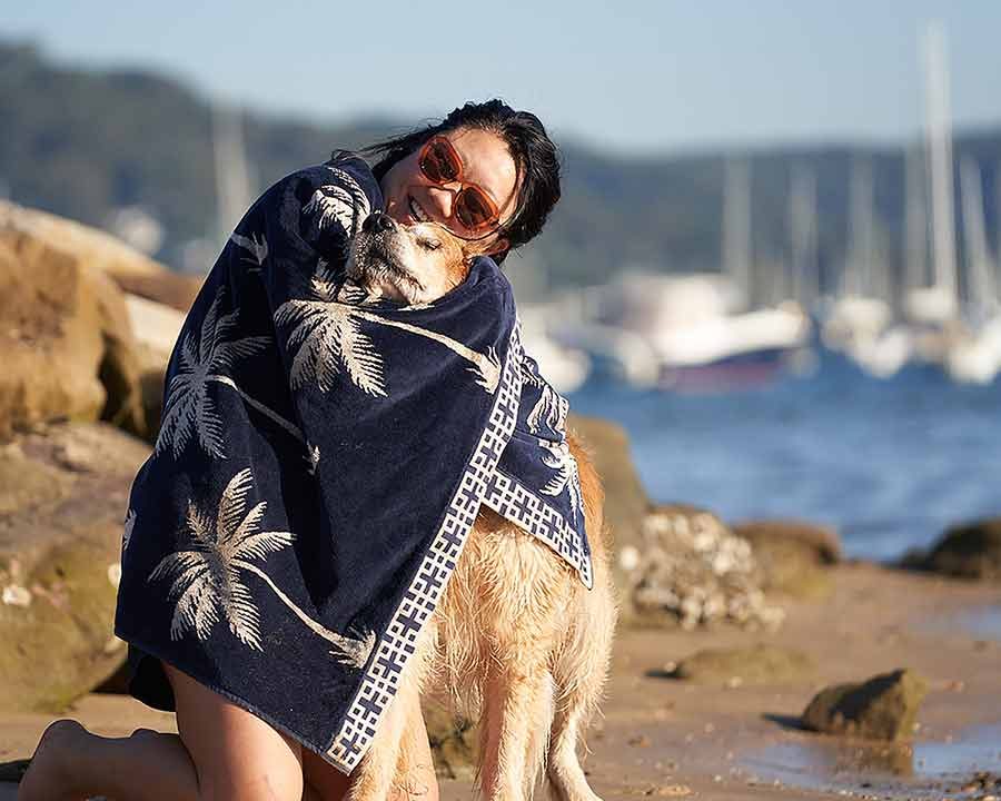 Nagi hugging Dozer with beach towel