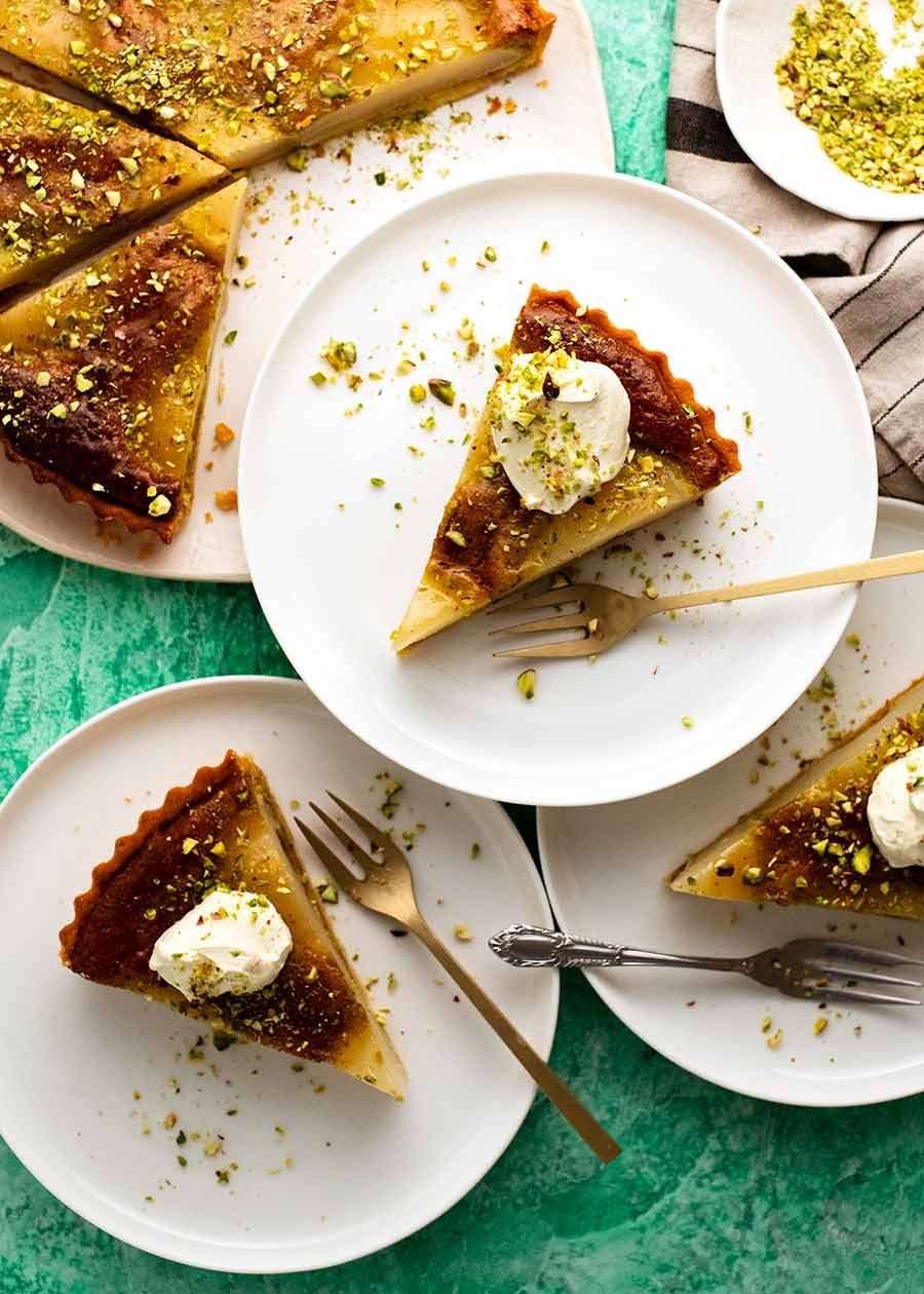 Overhead photo of Pistachio Pear Tart slices being served