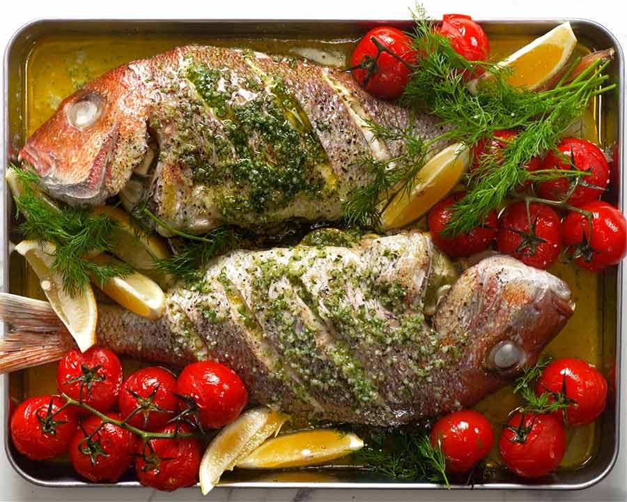 Freshly baked whole snapper with lemon butter dill sauce