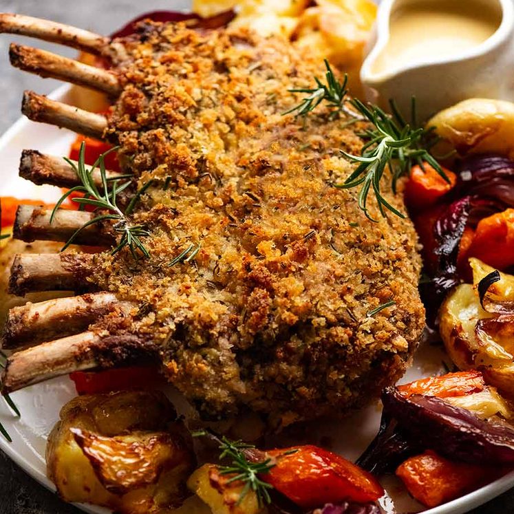 Rosemary Crumbed Rack of Lamb on a plate with roasted vegetables