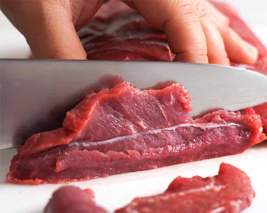 Slicing beef oyster blade (aka Flat Iron steak) for Korean BBQ Marinated Beef Short Ribs (Galbi)