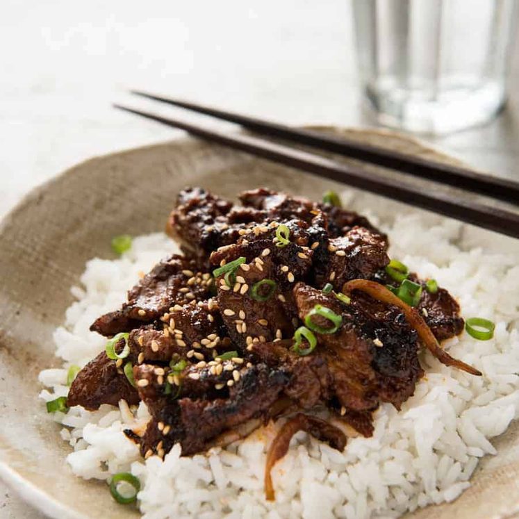 Spicy Korean Pork Stir Fry with chopsticks