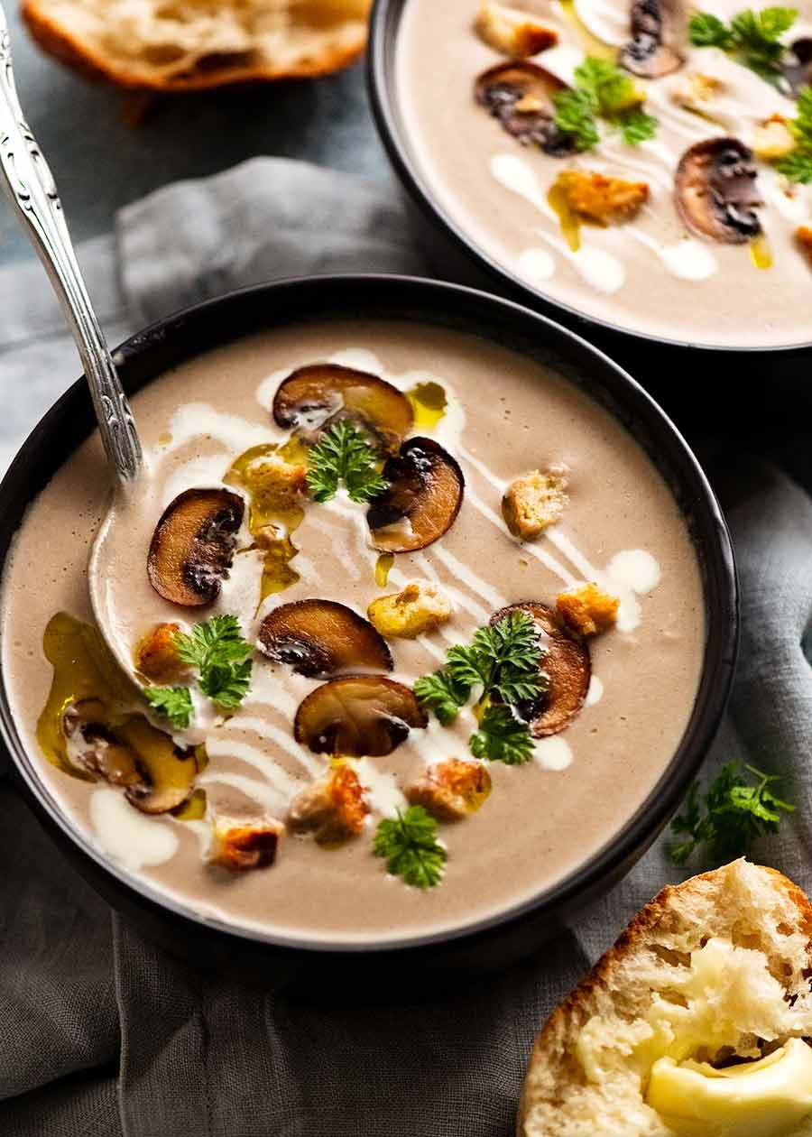 Bowl of Mushroom Soup garnished with golden mushrooms