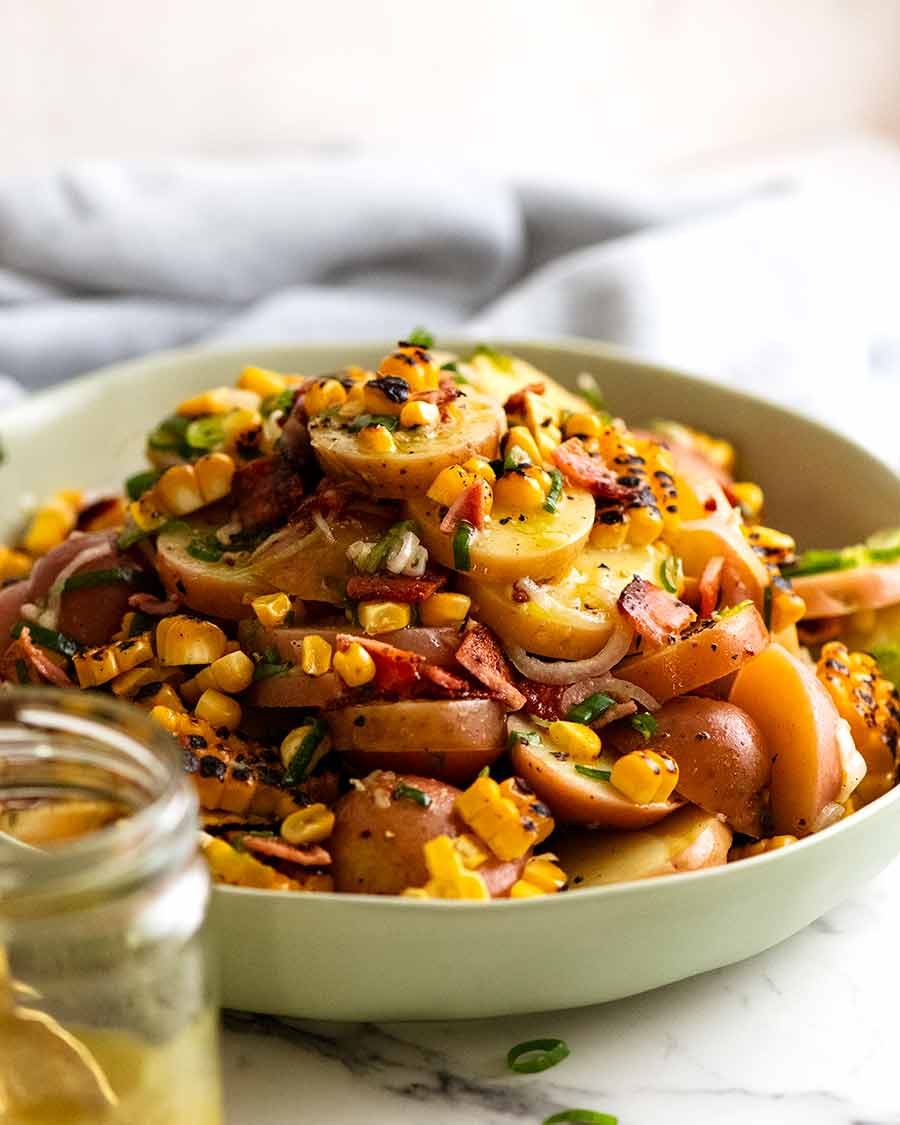 Big bowl filled with Red Potato Salad with Bacon and Corn ready to be eaten