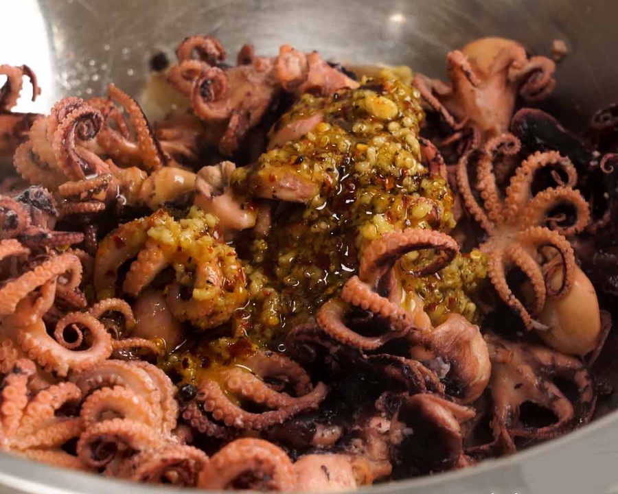 Marinating baby octopus