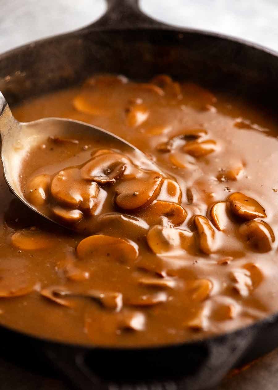 Mushroom Gravy in a black skillet, fresh off the stove