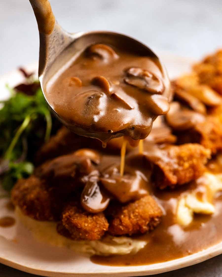 Ladling Mushroom Gravy over schnitzel