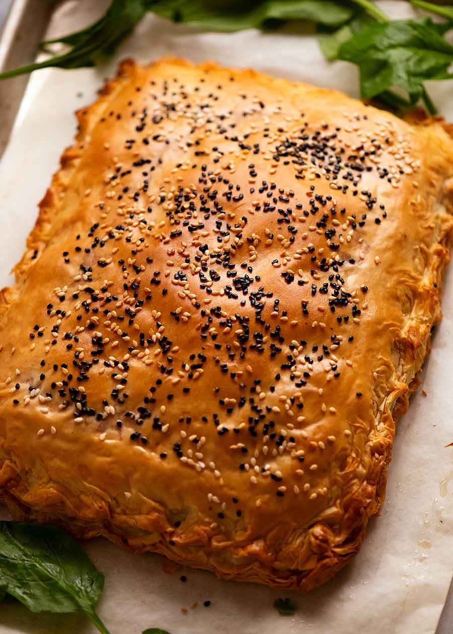 Fresh baked Spanakopita on a baking tray