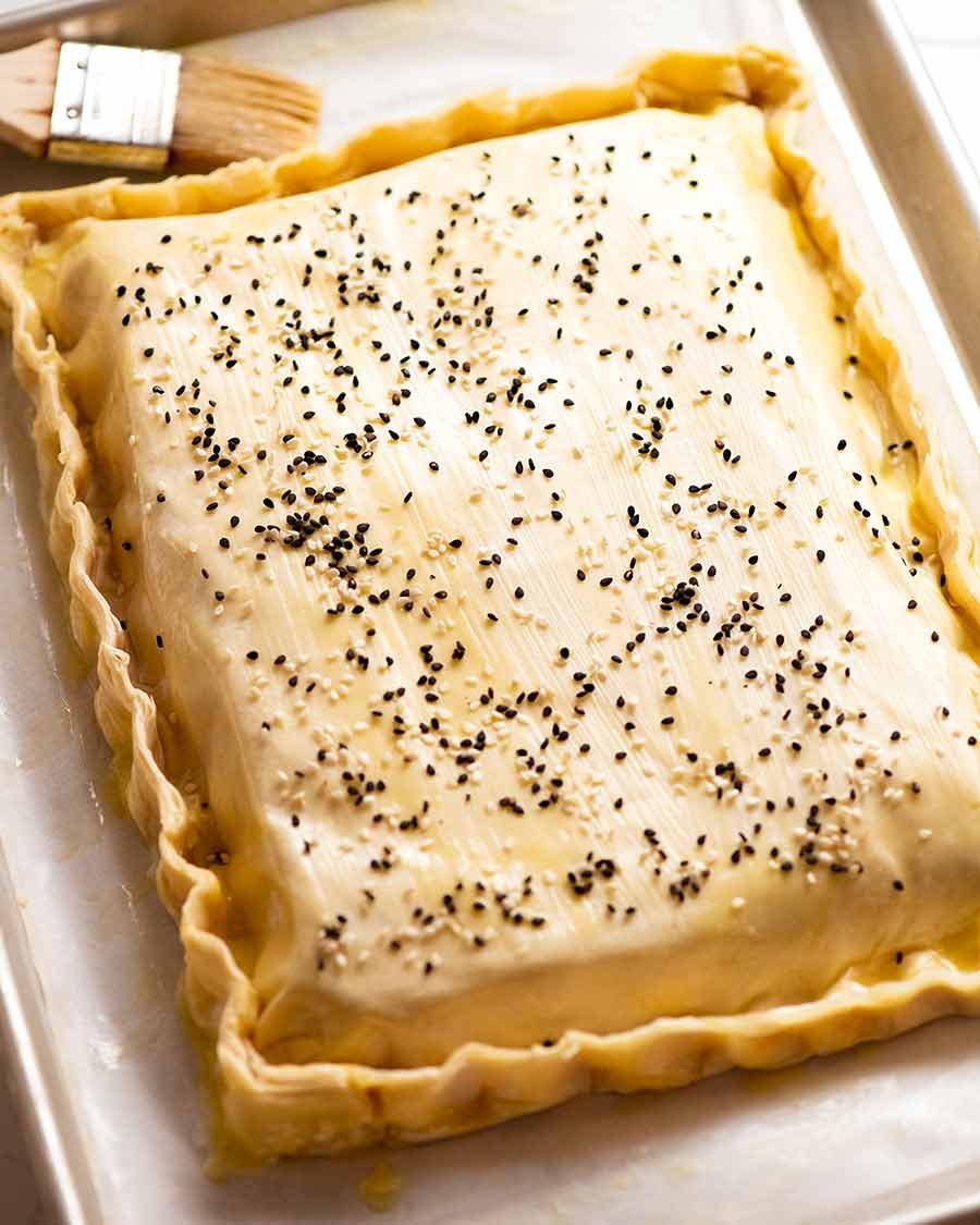 Spanakopita on a tray ready to be baked