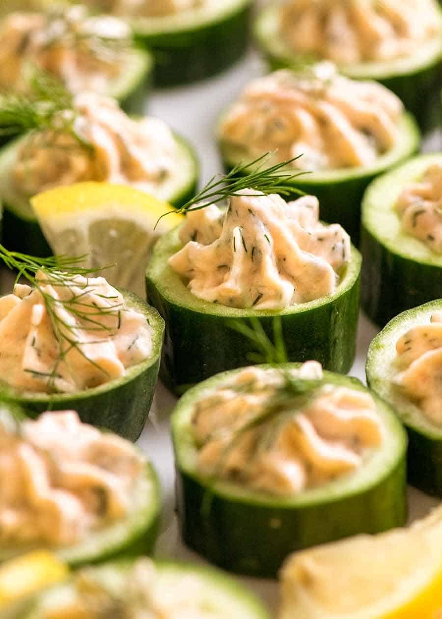 cucumber-canapes-with-smoked-salmon-mousse_4 Close up of Cucumber Canapés topped with smoked salmon mousse garnished with dill