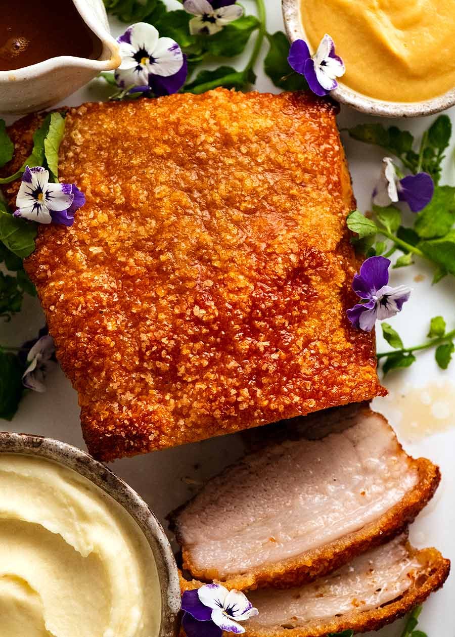 overhead-slow-roasted-pork-belly Overhead photo of Slow Roasted Crispy Pork Belly with Apple Sauce and Jus